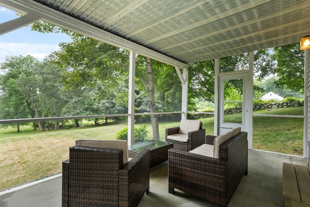 444 Middle Road Boxborough, MA 01719 - Photo 27 of 42 a balcony with furniture and a garden