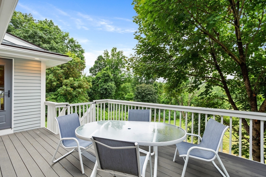 444 Middle Road Boxborough, MA 01719 - Photo 29 of 42 a view of a chair in wooden deck