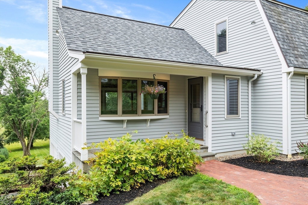 444 Middle Road Boxborough, MA 01719 - Photo 30 of 42 a front view of a house with garden