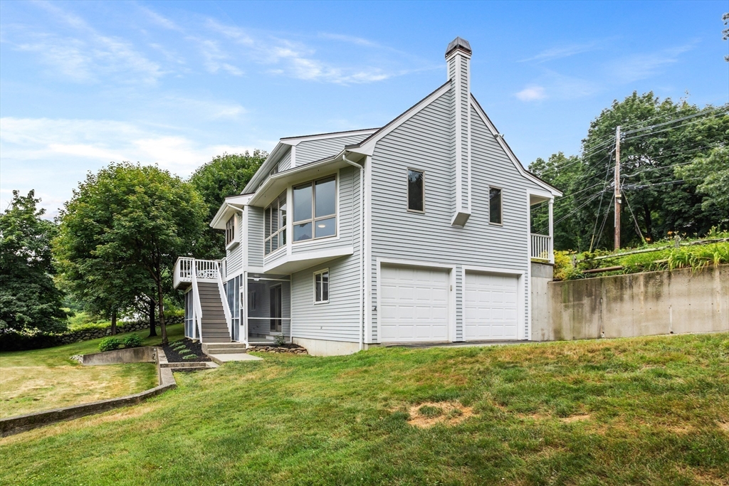 444 Middle Road Boxborough, MA 01719 - Photo 31 of 42 a view of a house with a yard