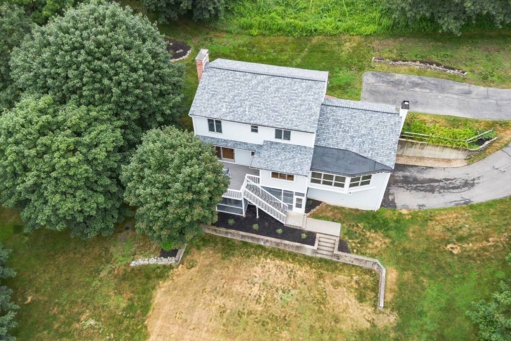 444 Middle Road Boxborough, MA 01719 - Photo 34 of 42 an aerial view of a house with swimming pool and large trees