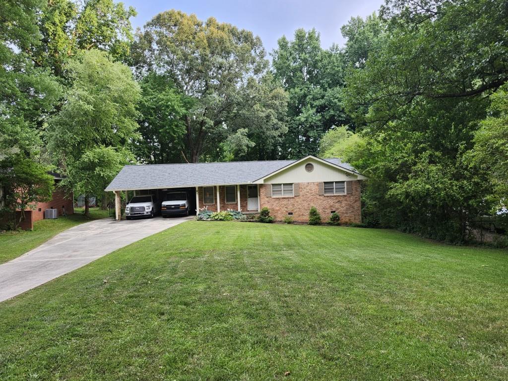2394 Ridgeway Drive Atlanta, GA 30360 - Photo 1 of 1 a front view of a house with garden