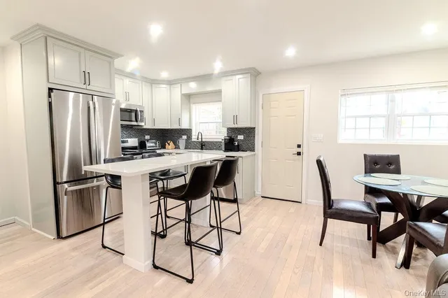 a view of a chairs and tables in the balcony