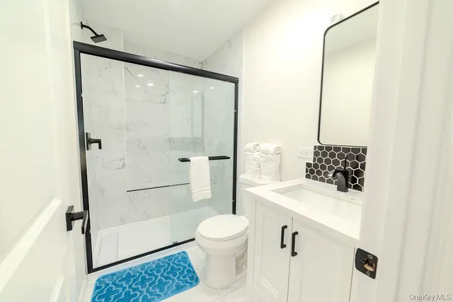 a bedroom with a bed and a mirror