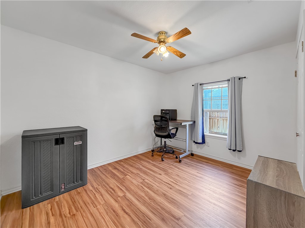 4214 Valley Circle Corpus Christi, TX 78413 - Photo 15 of 28 a view of a workspace with wooden floor and a window