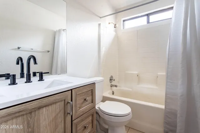 a bathroom with a sink a toilet and a bathtub