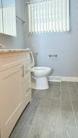 a bathroom with a toilet and a washing machine