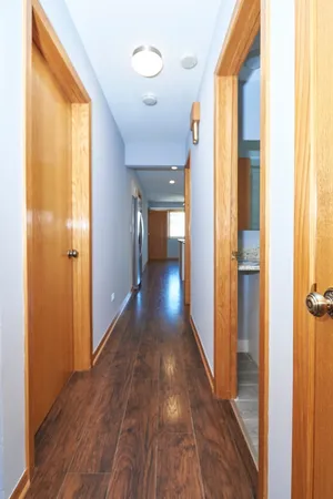 a view of gallery with wooden floor