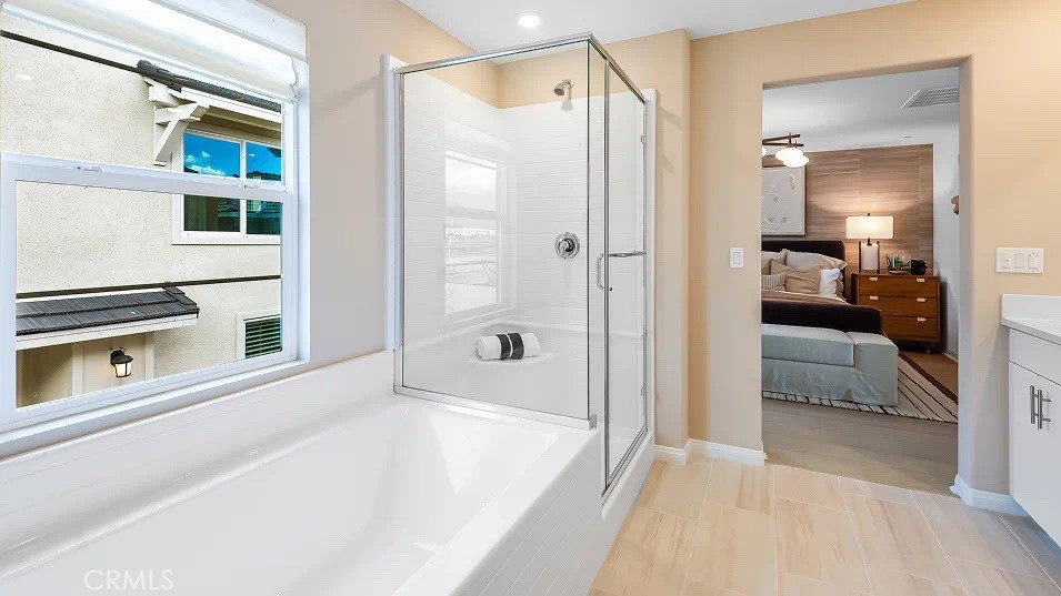 1676 Phantom Lane Rialto, CA 92376 - Photo 15 of 22 a bathroom with a tub and a shower