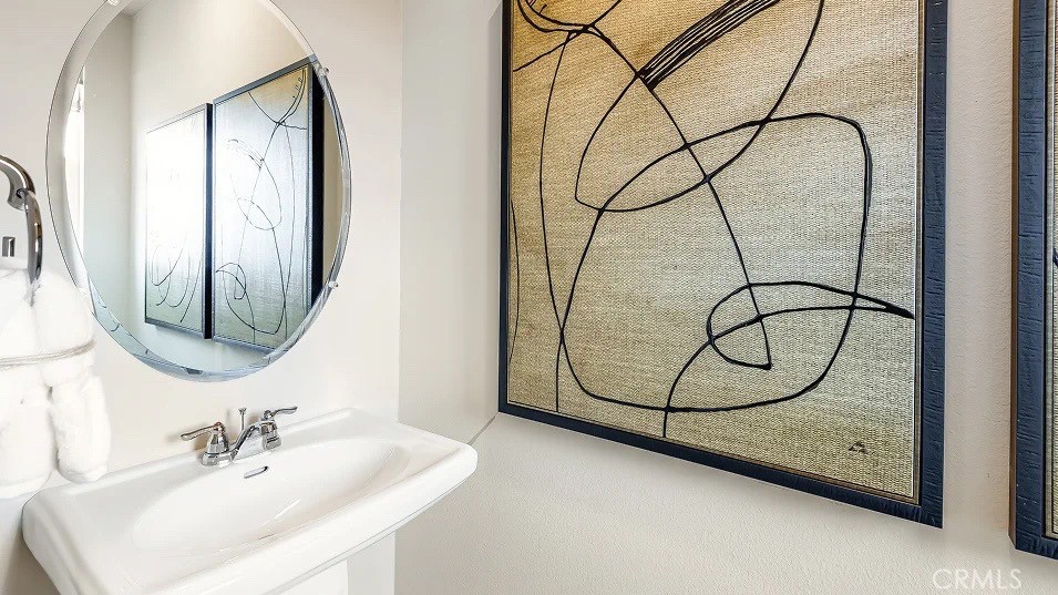 1676 Phantom Lane Rialto, CA 92376 - Photo 7 of 22 a bathroom with a sink a mirror and a glass door shower