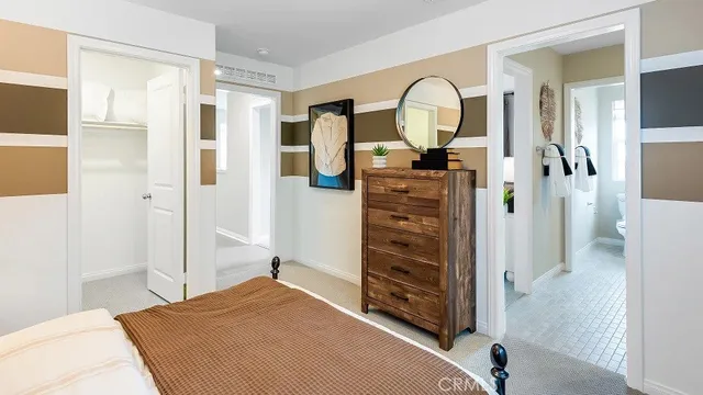 a view of a bedroom with wooden floor