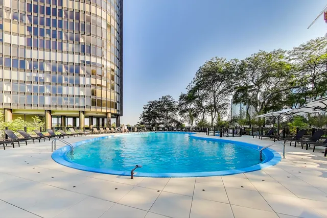 a view of a swimming pool with a patio