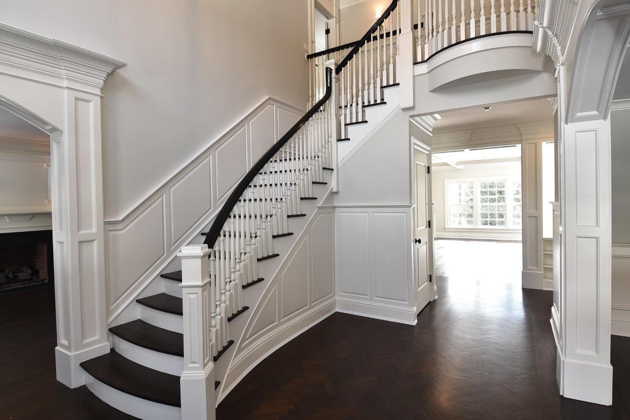 235 Cheese Spring Road Wilton, CT 06897 - Photo 5 of 55 a view of staircase with wooden floor and white walls