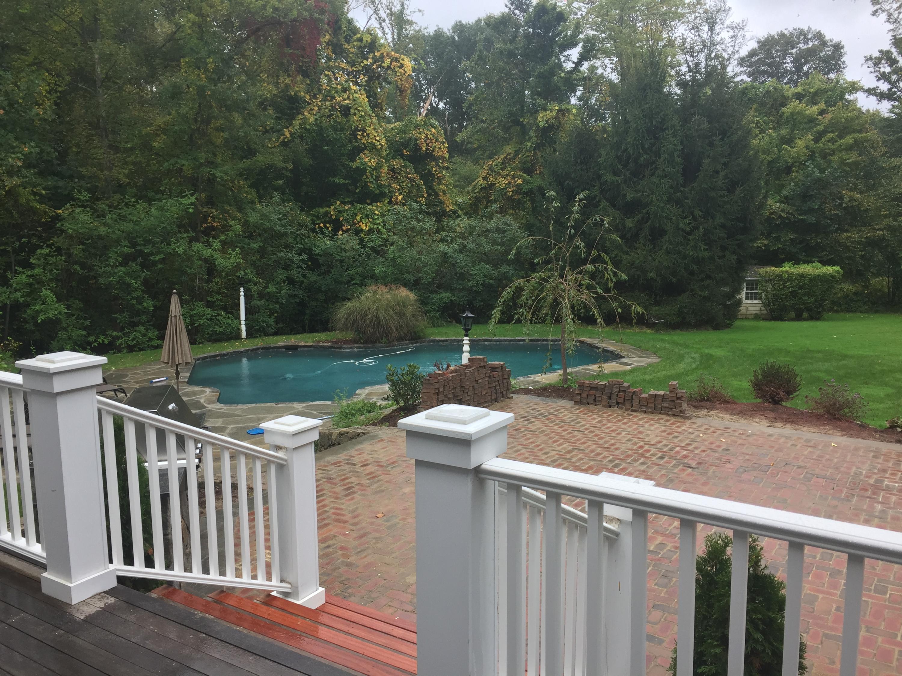 235 Cheese Spring Road Wilton, CT 06897 - Photo 54 of 55 a view of a deck with a yard and furniture