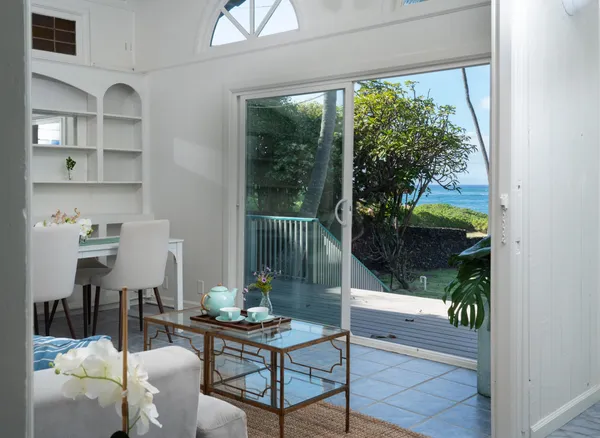 a living room with furniture a window and a fireplace