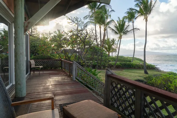a view of a balcony with wooden floor