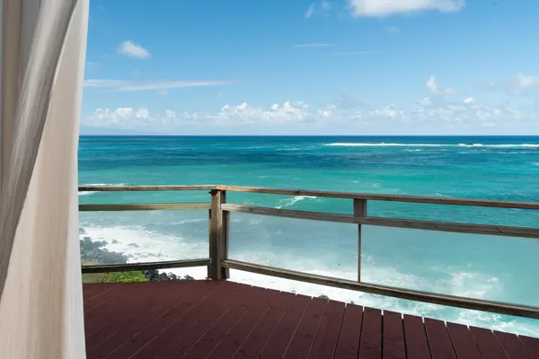 a view of an ocean from a balcony