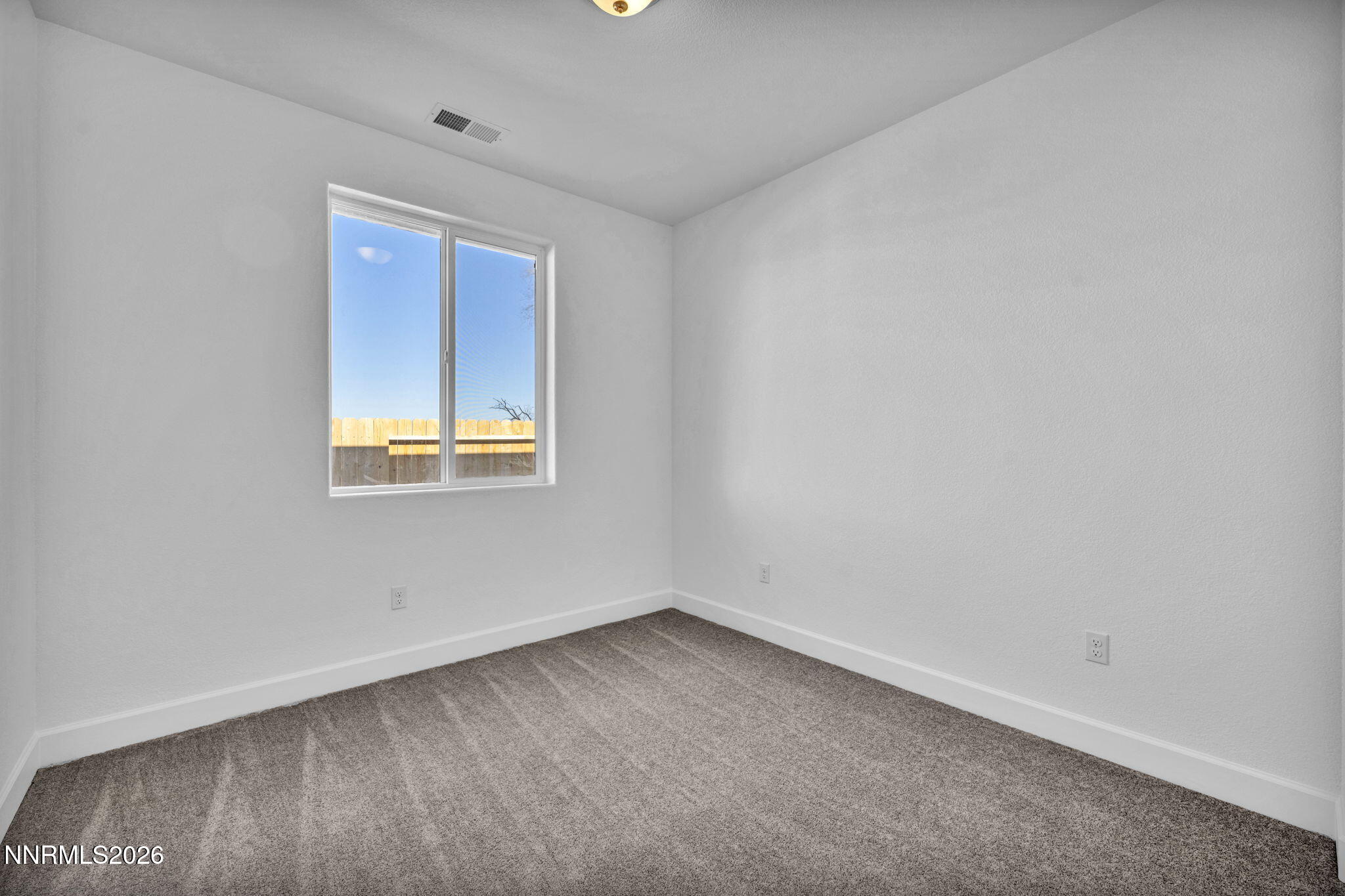3659 Carson Way, Unit LOT 117 Fernley, NV 89408 - Photo 17 of 24 an empty room with a window
