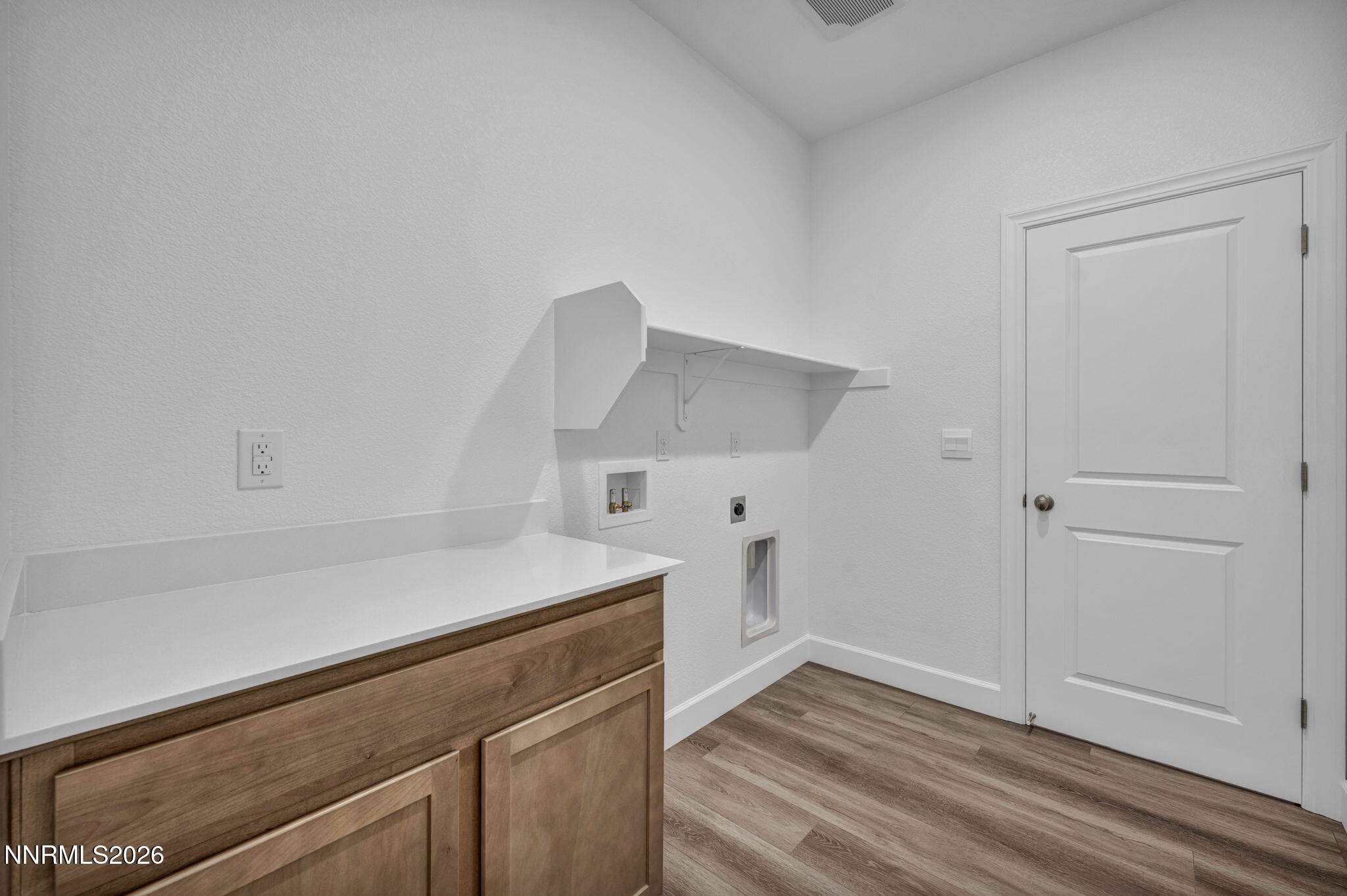 3659 Carson Way, Unit LOT 117 Fernley, NV 89408 - Photo 18 of 24 a view of cabinets and wooden floor