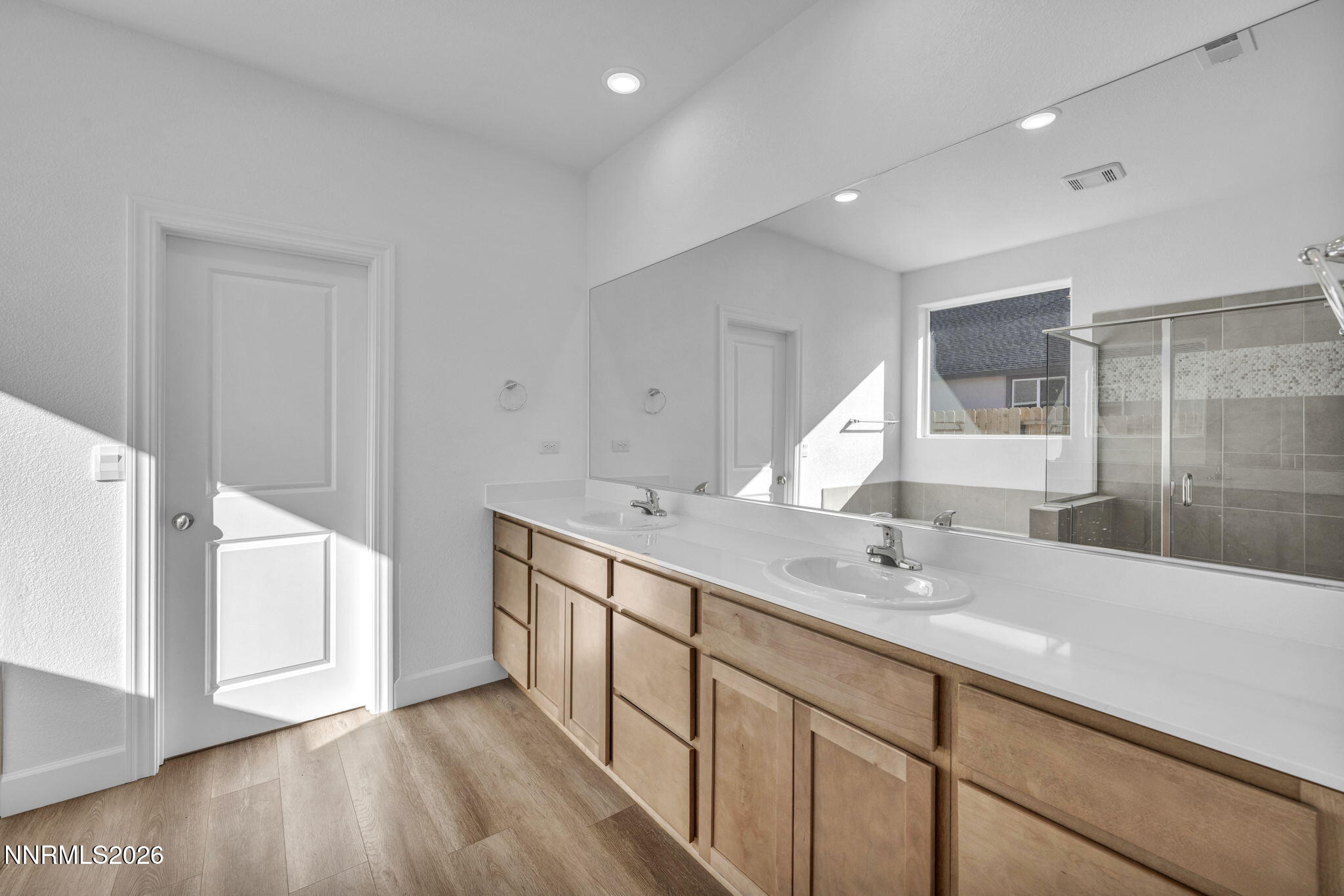 3659 Carson Way, Unit LOT 117 Fernley, NV 89408 - Photo 20 of 24 a bathroom with a double vanity sink and a mirror