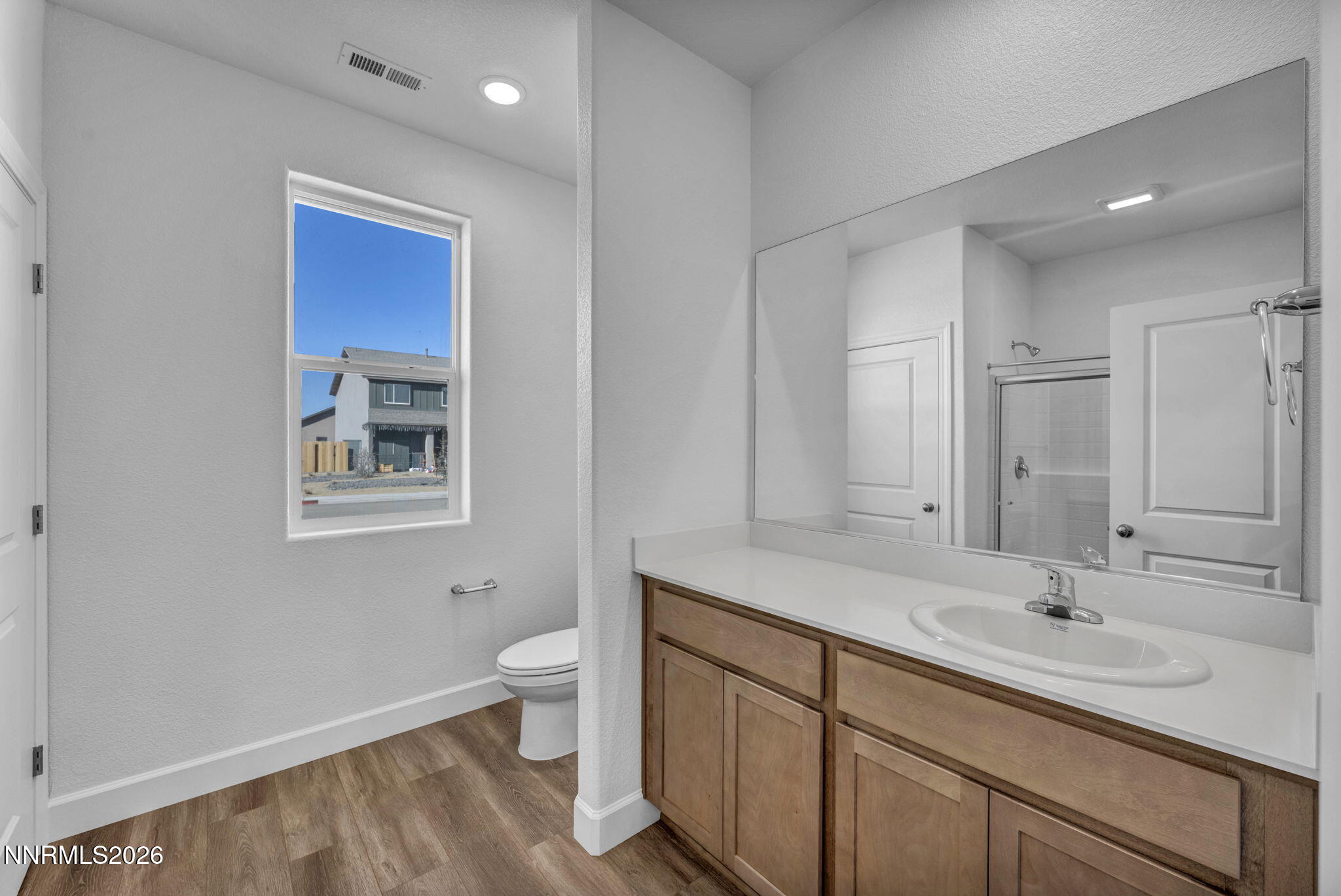 3659 Carson Way, Unit LOT 117 Fernley, NV 89408 - Photo 21 of 24 a bathroom with a sink double vanity and a toilet