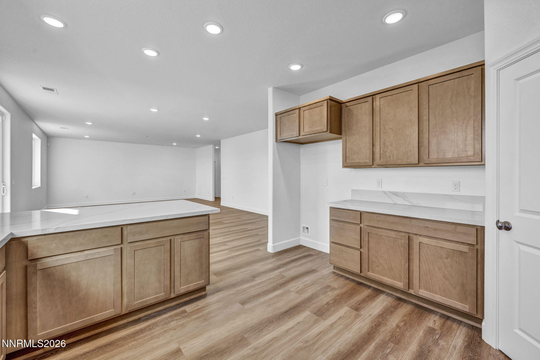 3659 Carson Way, Unit LOT 117 Fernley, NV 89408 - Photo 9 of 24 a large kitchen with stainless steel appliances granite countertop a sink and cabinets