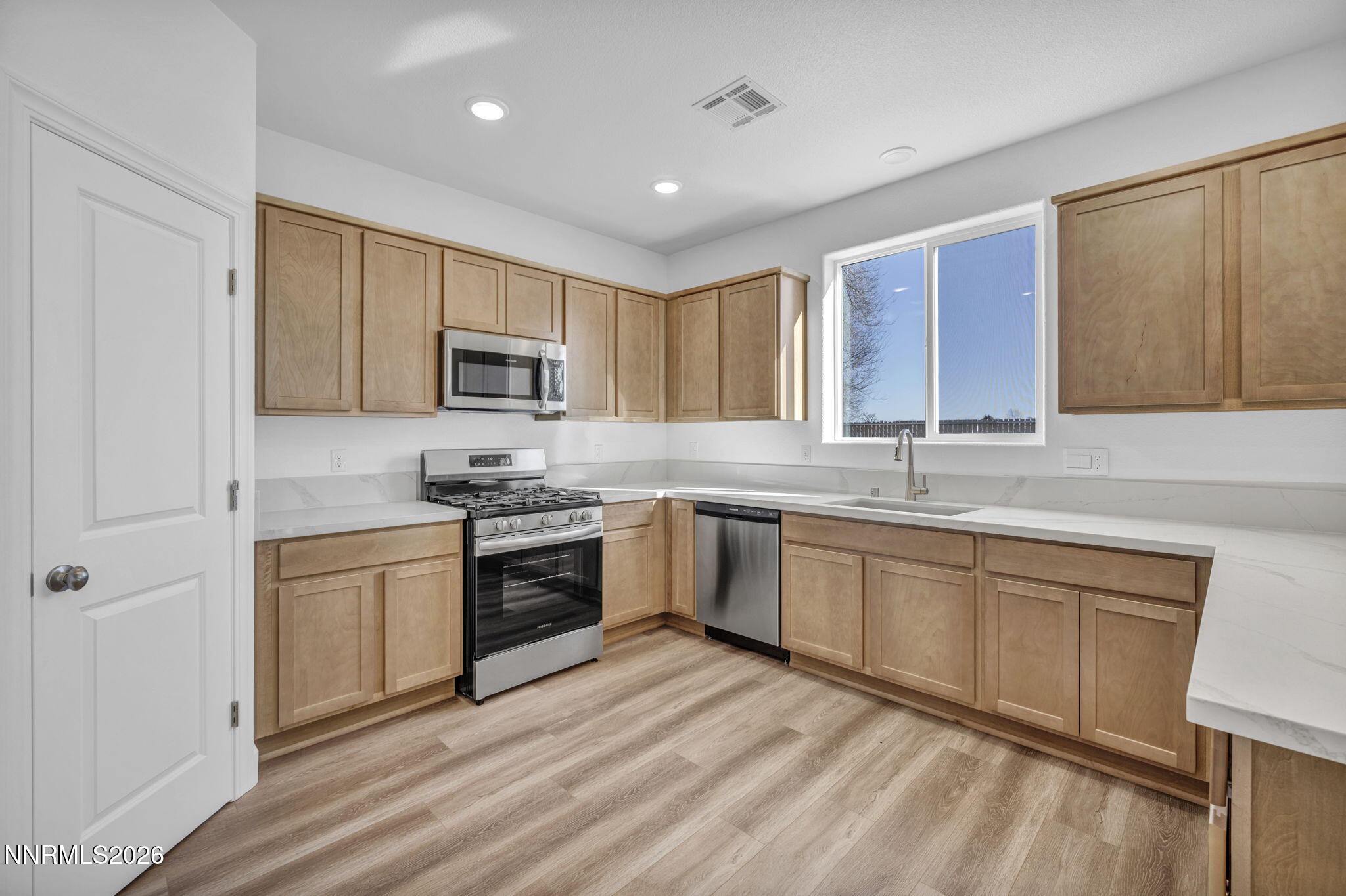 3659 Carson Way, Unit LOT 117 Fernley, NV 89408 - Photo 10 of 24 a kitchen with a sink cabinets and stainless steel appliances