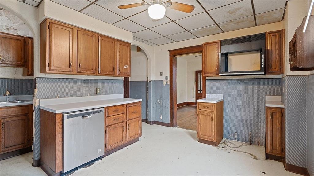 315 Catherine Street McKees Rocks, PA 15136 - Photo 14 of 38 a kitchen with stainless steel appliances granite countertop a stove a sink and a refrigerator