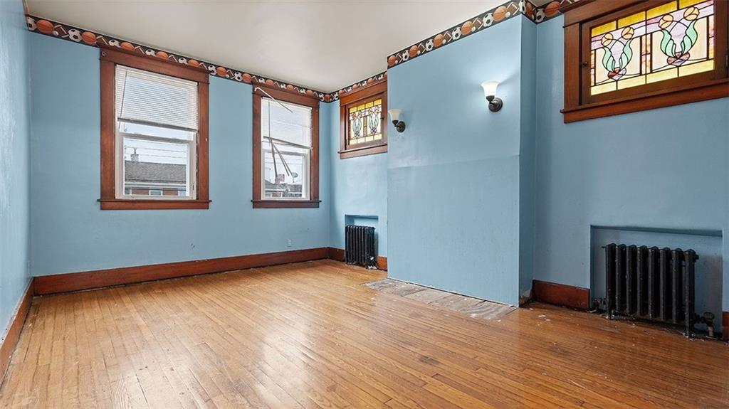 315 Catherine Street McKees Rocks, PA 15136 - Photo 18 of 38 a view of an empty room with wooden floor and a window