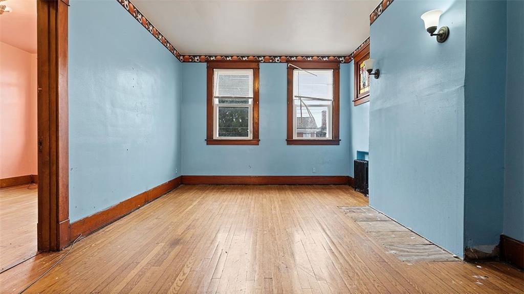 315 Catherine Street McKees Rocks, PA 15136 - Photo 19 of 38 a view of an empty room with wooden floor and a window