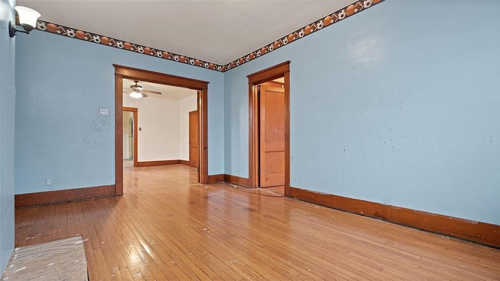 315 Catherine Street McKees Rocks, PA 15136 - Photo 20 of 38 a view of an empty room with wooden floor and a window