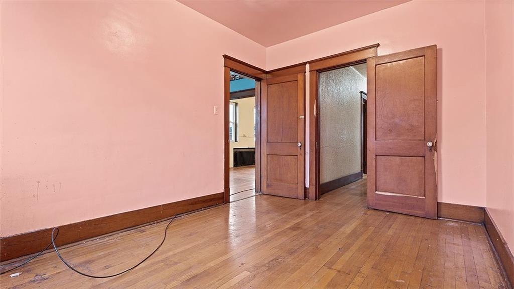 315 Catherine Street McKees Rocks, PA 15136 - Photo 21 of 38 an empty room with wooden floor and closet