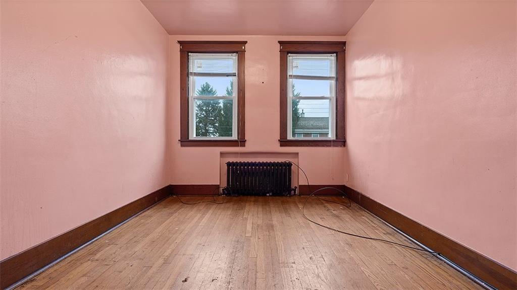 315 Catherine Street McKees Rocks, PA 15136 - Photo 22 of 38 a view of an empty room with wooden floor and a window