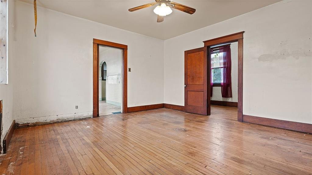 315 Catherine Street McKees Rocks, PA 15136 - Photo 23 of 38 a view of an empty room with wooden floor and a window