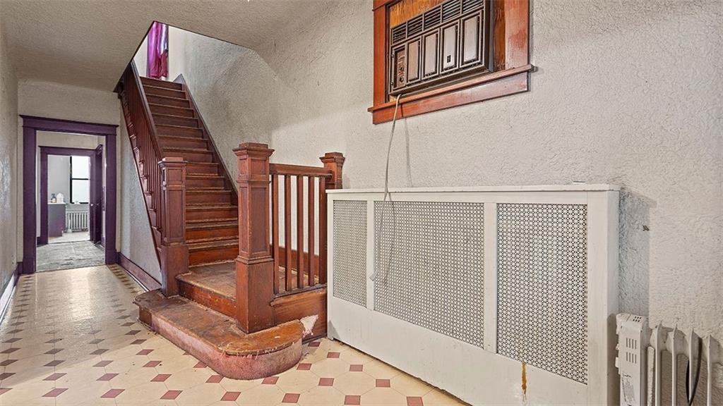 315 Catherine Street McKees Rocks, PA 15136 - Photo 4 of 38 a view of entryway with stairs and wooden floor