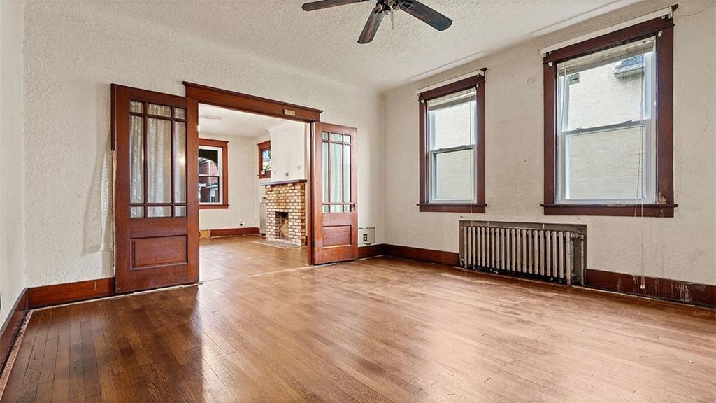 315 Catherine Street McKees Rocks, PA 15136 - Photo 8 of 38 wooden floor in an empty room with a window
