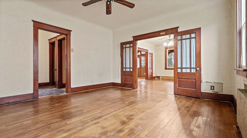315 Catherine Street McKees Rocks, PA 15136 - Photo 9 of 38 an empty room with wooden floor and windows