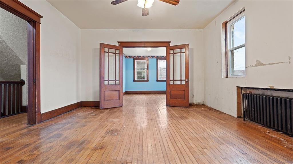 315 Catherine Street McKees Rocks, PA 15136 - Photo 10 of 38 wooden floor in an empty room with a window