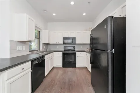 a view of a hallway with washer and dryer