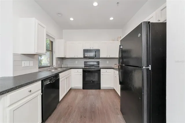 a view of a hallway with washer and dryer