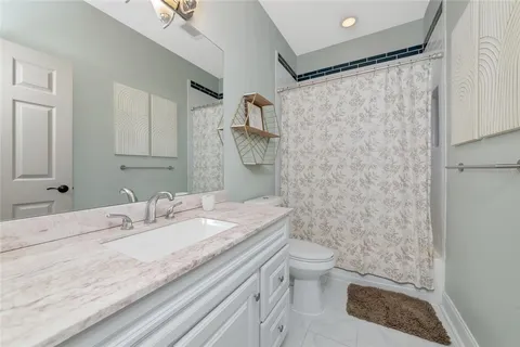 a view of a porch with chairs and potted plants