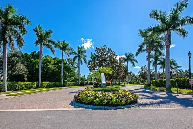 a aerial view of a house with a yard and potted plants