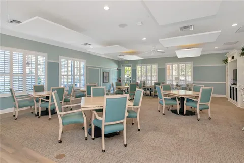 an aerial view of residential houses with outdoor space and ocean view