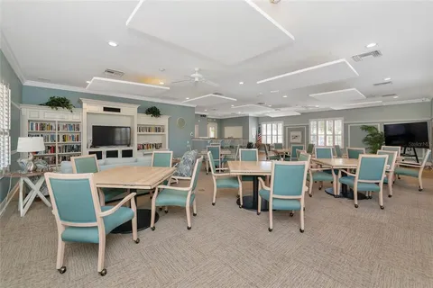 an aerial view of residential houses with outdoor space and swimming pool