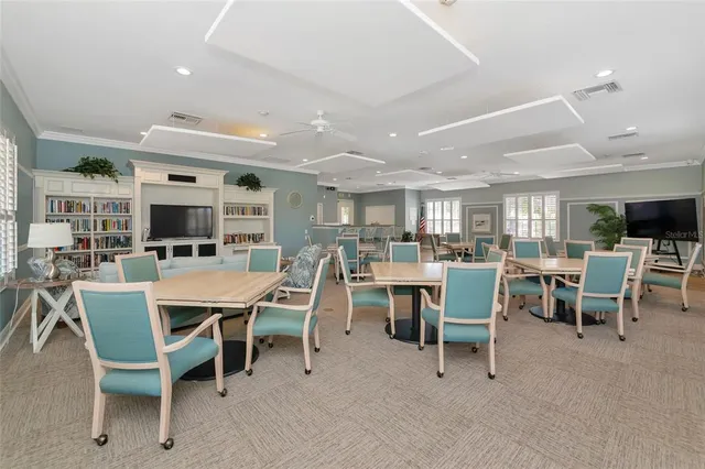 an aerial view of residential houses with outdoor space and swimming pool