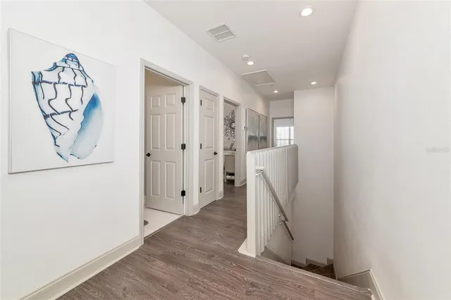 a living room with furniture ceiling fan and a window