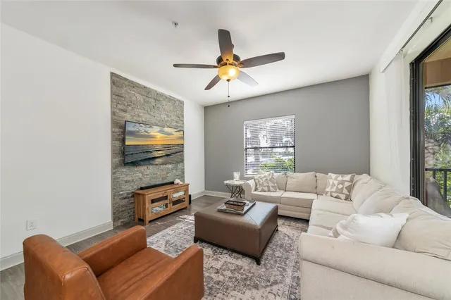 a kitchen with stainless steel appliances granite countertop a stove a sink and white cabinets