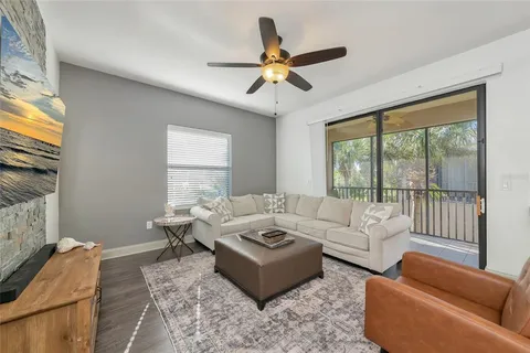 a kitchen with granite countertop white cabinets stainless steel appliances and sink