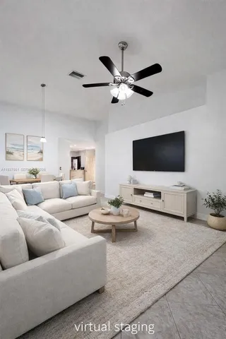 a living room with furniture and a flat screen tv
