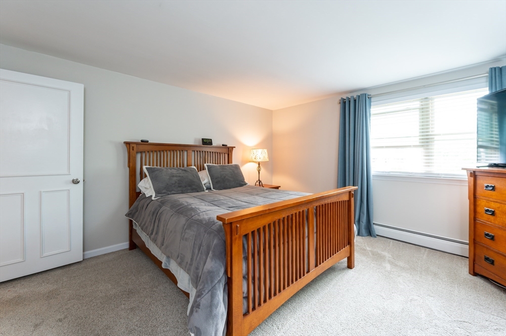 8 Jacques Lane Gloucester, MA 01930 - Photo 13 of 36 a bedroom with a bed and a window